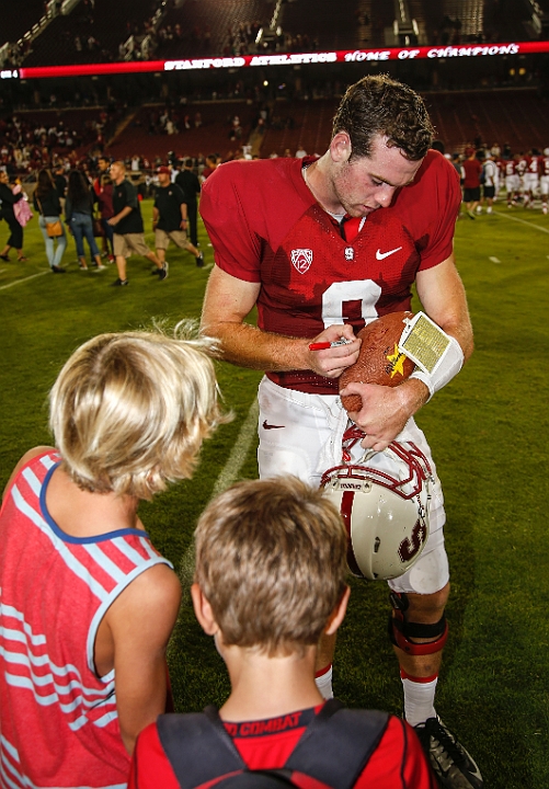 130907-Stanford-SanJose-024.JPG - Sept.7, 2013; Stanford, CA, USA; Stanford Cardinal quarterback Kevin Hogan (8) signs an autograph after game against the San Jose State Spartans at  Stanford Stadium. Stanford defeated San Jose State 34-13.